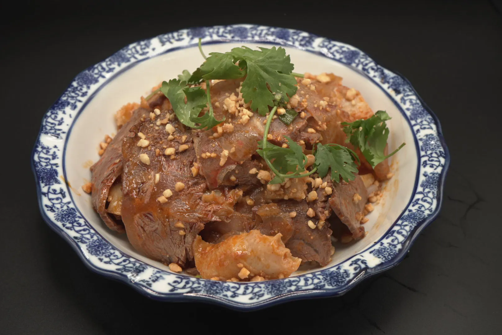Spicy beef slices with peanuts and cilantro at Lao Hu Tong, a Asian Restaurant in Schaumburg